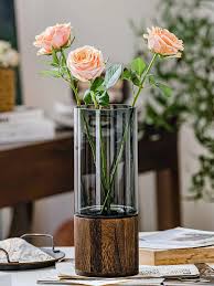 Modern creative glass vase with wooden base